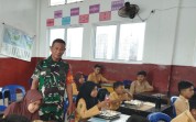 Program Gizi Nasional Hadir di Dumai, Babinsa Ratu Sima Turun Langsung Dampingi